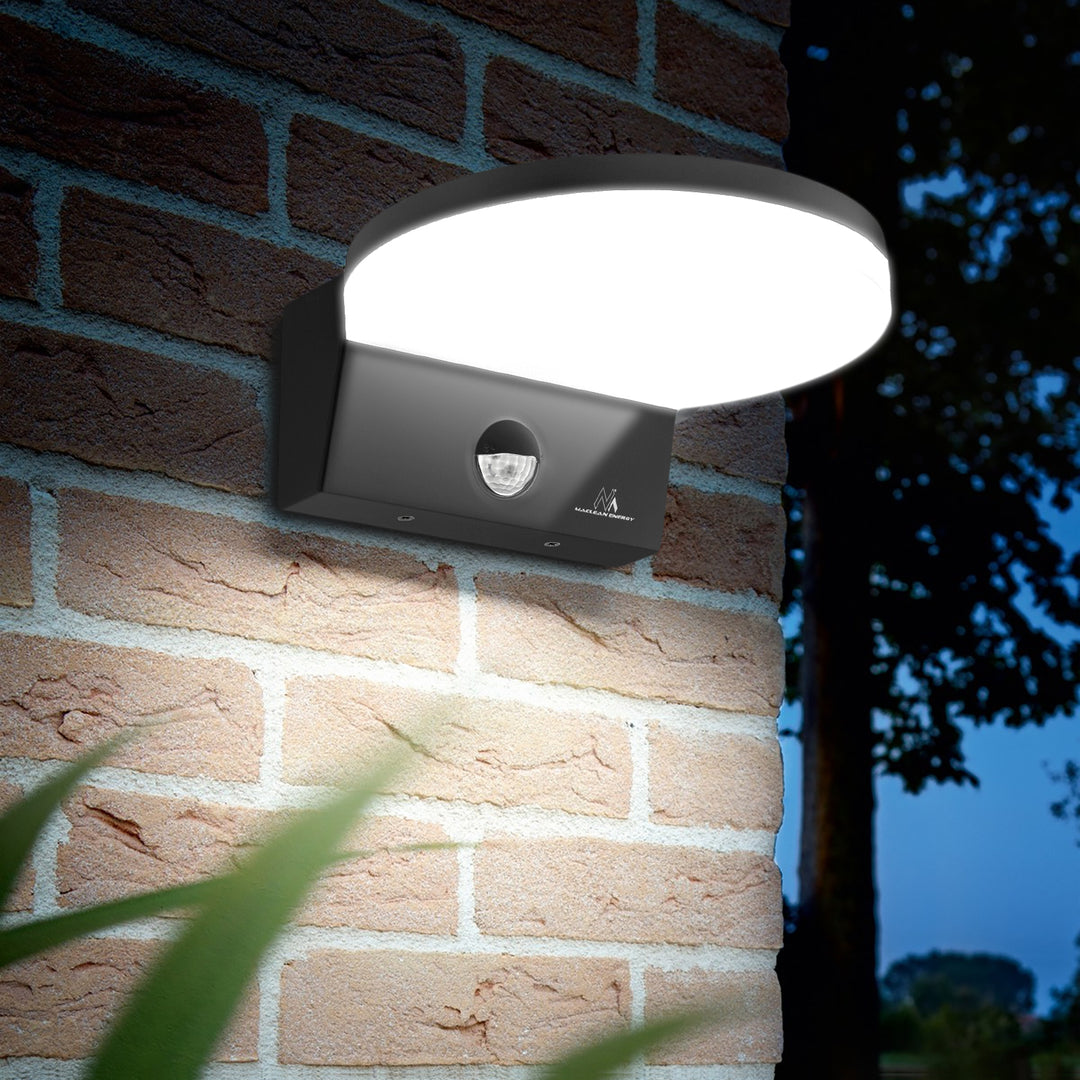 Maclean MCE344 GR motion sensor LED lamp. Featuring a PIR motion sensor, it emits a neutral white light (4000K) with 15W power and 1560lm brightness. Rated IP65, it ensures durability and reliability in various settings.