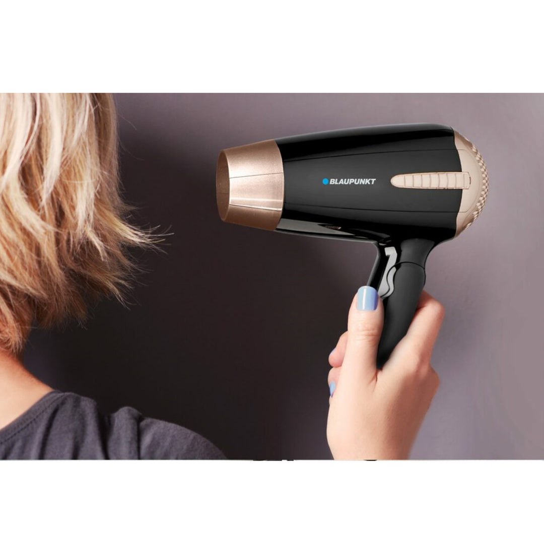 Sèche-cheveux avec deux puissances 200 W Trois niveaux de température Poignée pliable Fonction air froid Noir/Cuivre